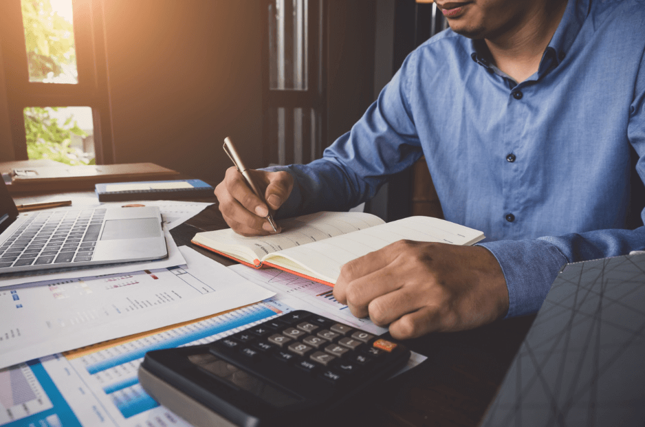 Man making notes in a notebook